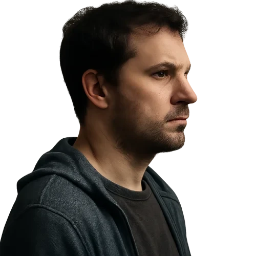 A MAN WITH SERIOUS EXPRESSION NOT TO BRIGHT LIGHTNING SIDE PROFILE IN CASUAL CLOTHES